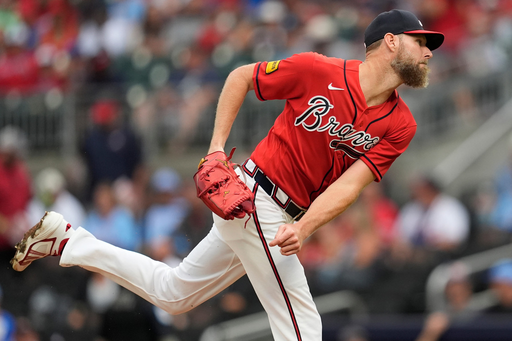 Atlanta Braves pitcher Chris Sale (51) works in the first inning of a baseball game against the Texas Rangers, Friday, July 17, 2026, in Atlanta. (AP Photo/Mike Stewart)