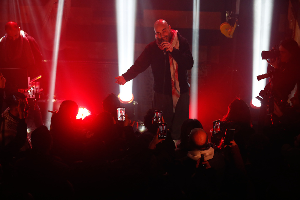 Hani Al Sawah, a Syrian rap artist known as Al Darwish, performs at a restaurant in old Damascus, Syria, Friday, Jan. 16, 2026. (AP Photo/Omar Sanadiki)