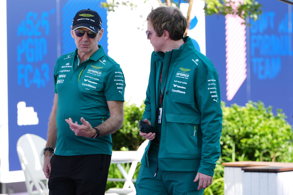 Aston Martin team principal Adrian Newey, left, talks with a team member as he arrives at the track ahead of the Australian Formula One Grand Prix at Albert Park, in Melbourne, Australia, Thursday, March 5, 2026. (AP Photo/Asanka Brendon Ratnayake)
