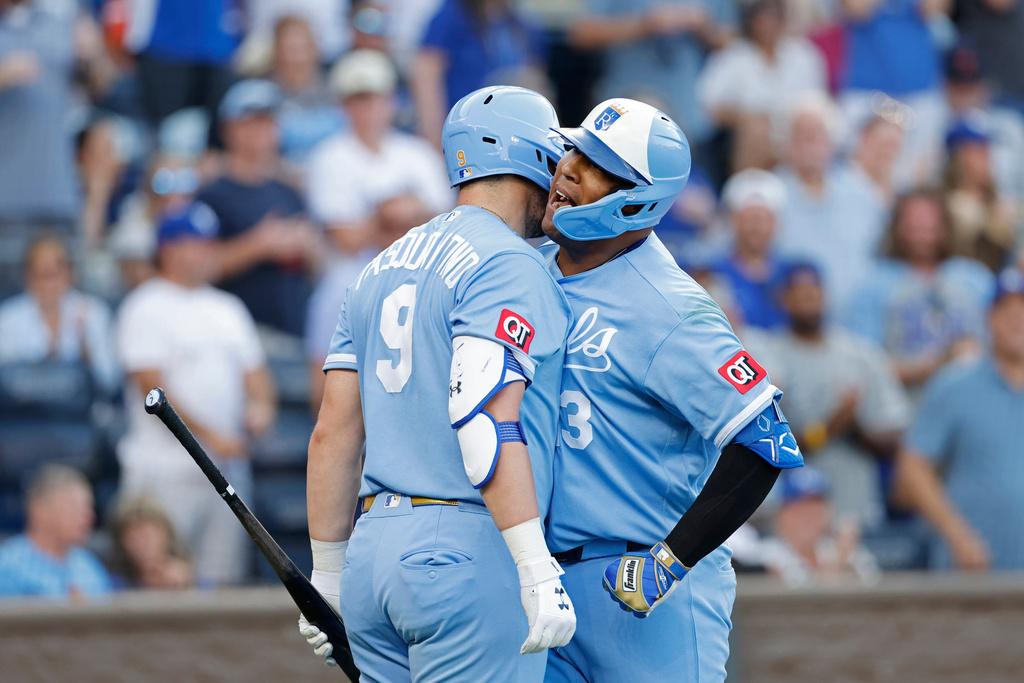 Kansas City Royals' Vinnie Pasquantino (9) congratulates Salvador Perez (13) after a home run during the fourth inning of a baseball game against the Detroit Tigers in Kansas City, Mo., Saturday, Aug. 22, 2026. (AP Photo/Colin E. Braley)