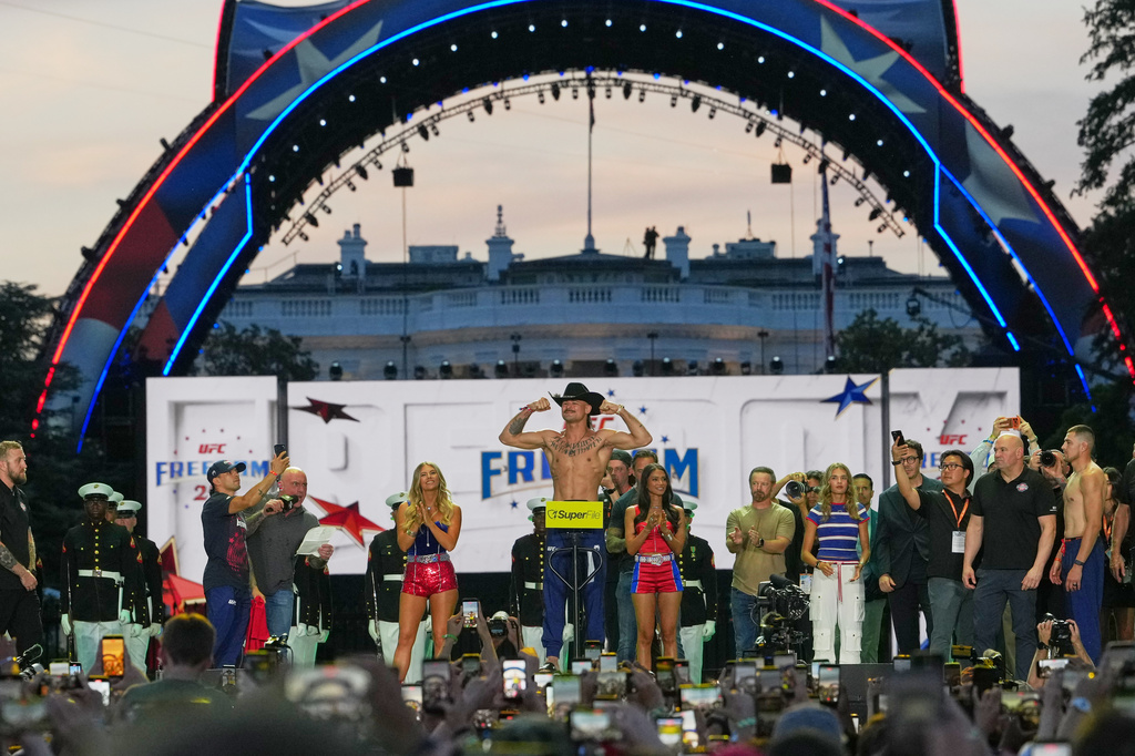 Diego Lopes participates in the ceremonial UFC Freedom 250 weigh-ins on the Ellipse, Saturday, June 13, 2026, in Washington, ahead of Sunday's fight on the South Lawn of the White House. (AP Photo/Julia Demaree Nikhinson)