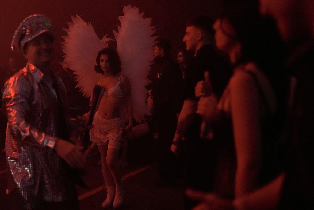 People dressed in costumes attend a Halloween rave in Kyiv, Ukraine, Saturday, Oct. 25, 2025. (AP Photo/Julia Demaree Nikhinson)