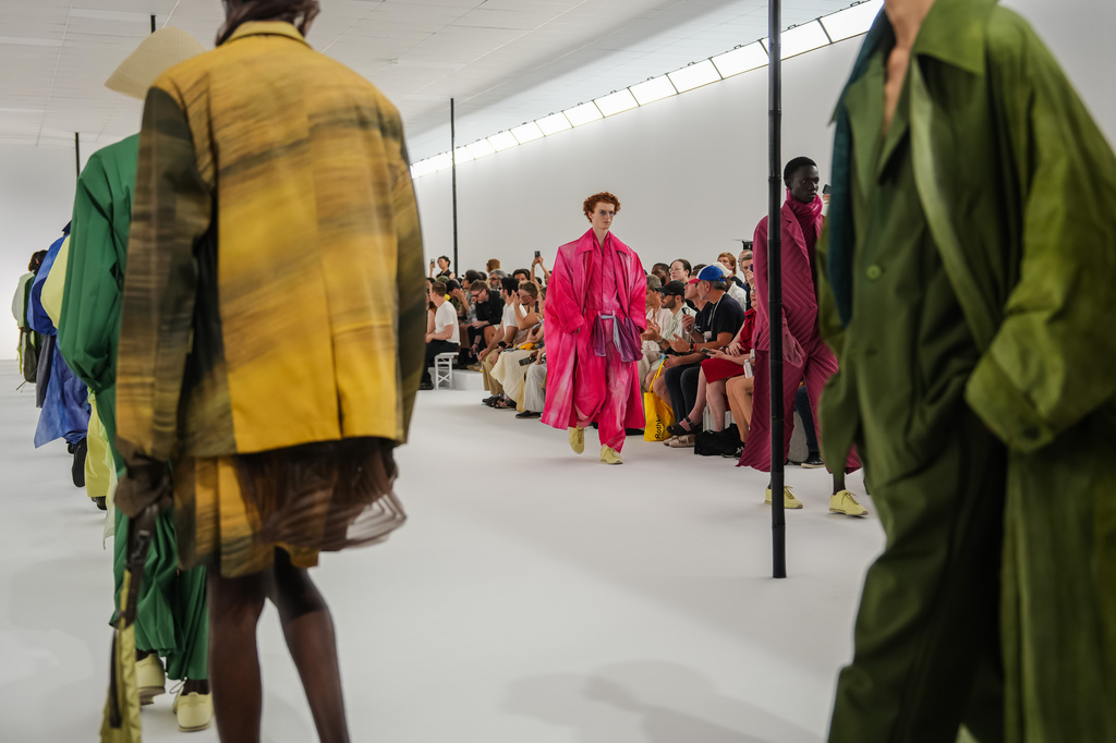 Models wear creations as part of the Issey Miyake Homme Spring Summer 2027 collection presented in Paris, France, Thursday, June 25, 2026. (AP Photo/Aurelien Morissard)