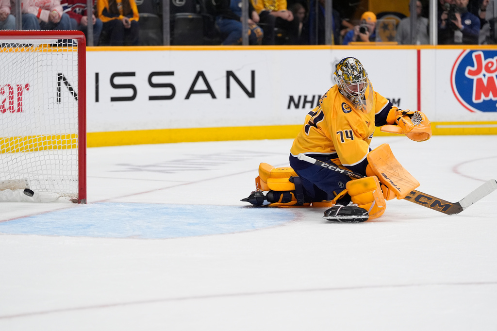Nashville Predators goaltender Juuse Saros (74) looks back as a goal is scored by Montreal Canadiens right wing Ivan Demidov (not pictured) during the first period of an NHL hockey game Saturday, March 28, 2026, in Nashville, Tenn. (AP Photo/George Walker IV)