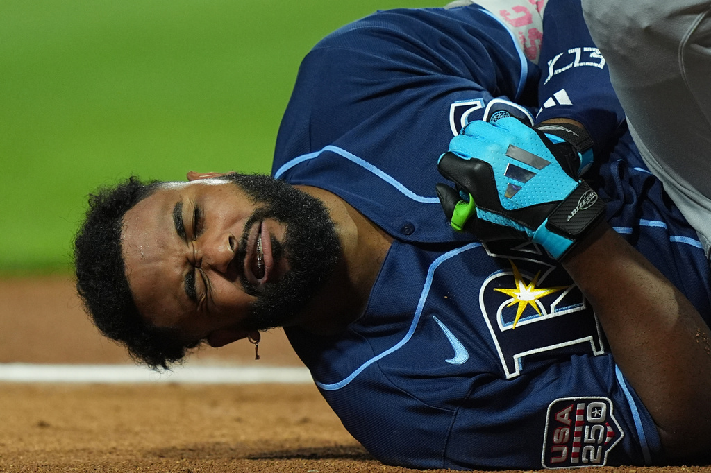 Tampa Bay Rays' Junior Caminero reacts after being hit by a pitch by St. Louis Cardinals' Riley O'Brien in the third inning of the MLB baseball All-Star Game between the American League and National League, Tuesday, July 14, 2026, in Philadelphia. (AP Photo/Matt Rourke)