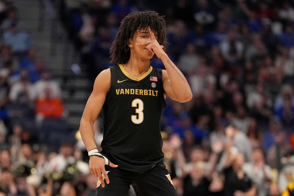 Vanderbilt guard Tyler Tanner (3) celebrates a three point basket during the first half of an NCAA college basketball game against Florida in the semifinals of the Southeastern Conference tournament Saturday, March 14, 2026, in Nashville, Tenn. (AP Photo/George Walker IV)