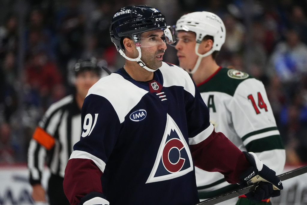 Colorado Avalanche center Nazem Kadri waits for a face off in the second period of an NHL hockey game against the Minnesota Wild, Sunday, March 8, 2026, in Denver. (AP Photo/David Zalubowski)