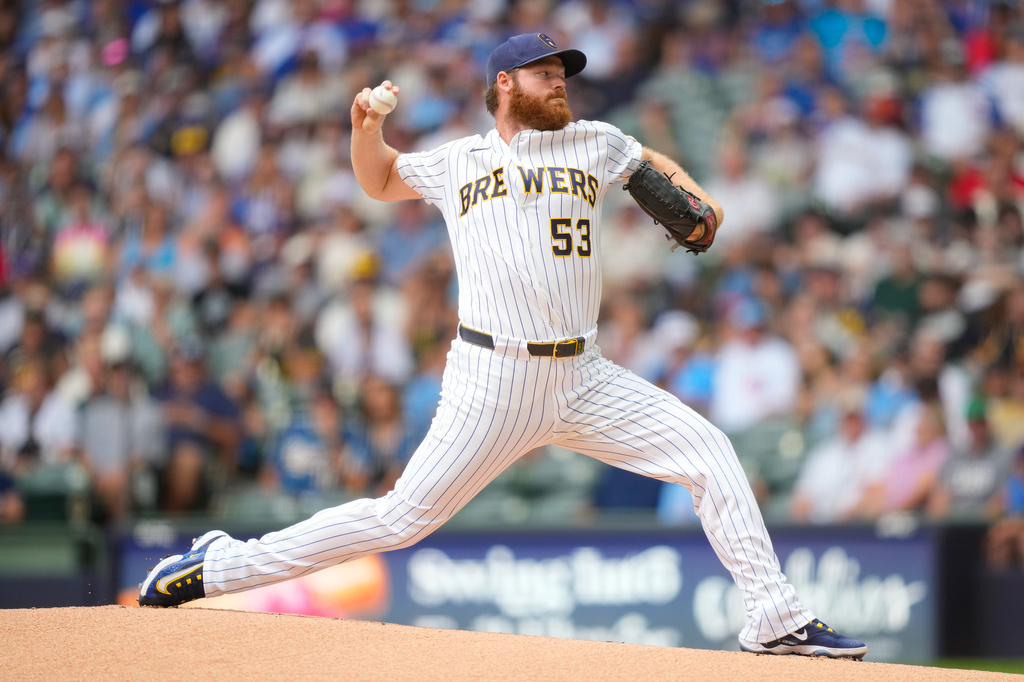 FILE - Milwaukee Brewers pitcher Brandon Woodruff throws during the first inning of a baseball game against the Chicago Cubs, June 28, 2026, in Milwaukee. (AP Photo/Kayla Wolf, File)