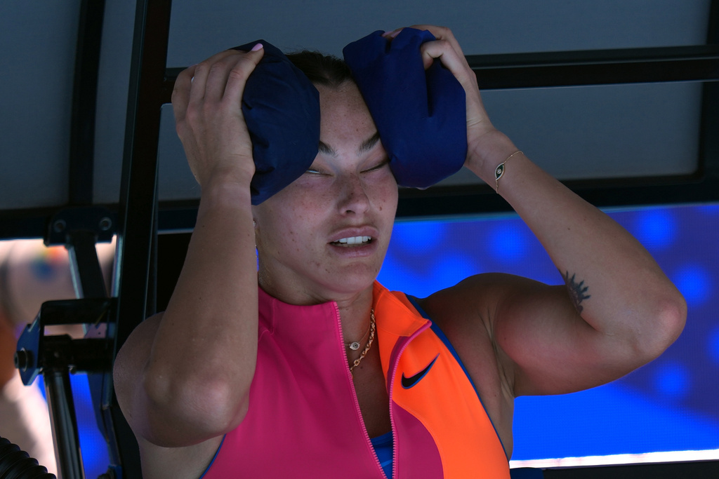 Aryna Sabalenka of Belarus places ice packs to her face during her quarterfinal match against to Iva Jovic of the U.S. at the Australian Open tennis championship in Melbourne, Australia, Tuesday, Jan. 27, 2026. (AP Photo/Aaron Favila)