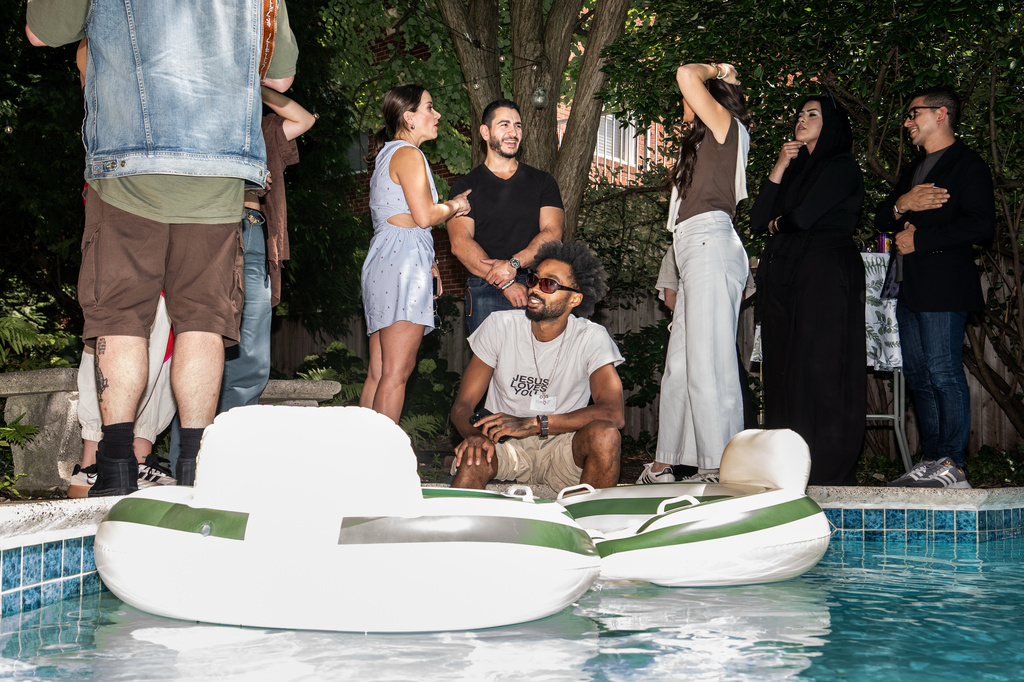 Abdul El-Sayed, a progressive candidate in the Democratic primary for U.S. Senate in Michigan, talks poolside at a party for content creators supporting his campaign, Monday, Aug. 3, 2026, in Detroit. (AP Photo/Julia Demaree Nikhinson)