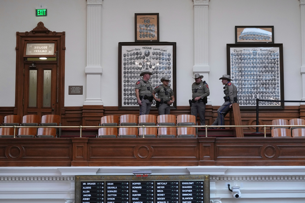 Texas Troopers gather in the gallery of the House Chamber at the Texas Capitol after a second special session was gaveled in, Monday, Aug. 18, 2025, in Austin, Texas. (AP Photo/Eric Gay)