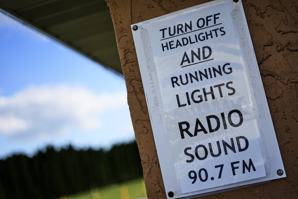 A reminder to turn off head lights at the entrance to Shankweiler Drive-In in Orefield, Pa., Friday, Aug. 29, 2025. (AP Photo/Gene J. Puskar)