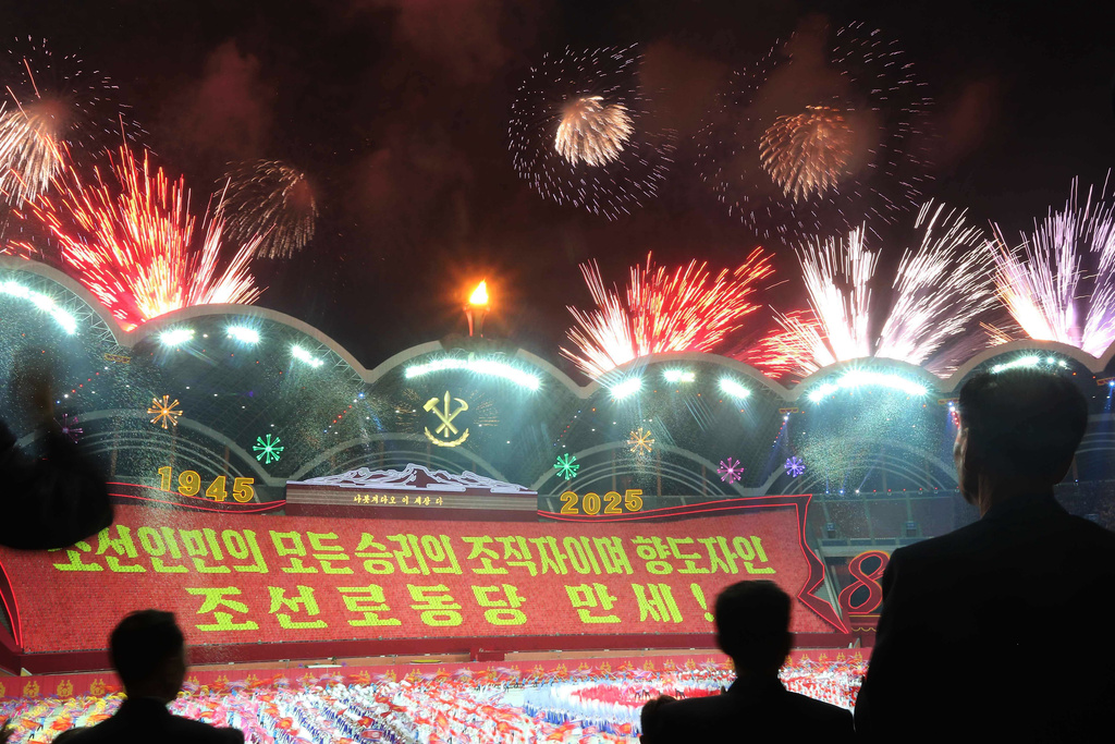 Fireworks explode at the May Day Stadium in Pyongyang, North Korea, Thursday, Oct. 9, 2025, during the ceremony marking the 80th anniversary of the founding of the ruling Workers' Party. The words at center read "Long live the Workers' Party of Korea, the organizer and guider of all the victories of the Korean people!" (AP Photo/Jon Chol Jin)
