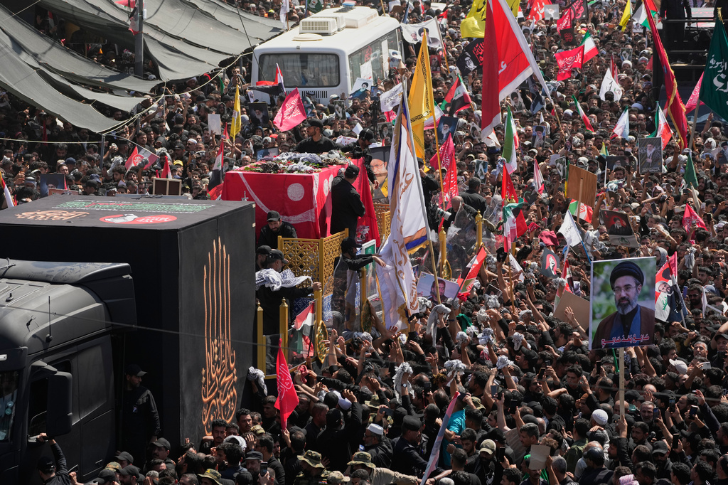 Mourners surround a truck carrying the coffin of Iranian Supreme Leader Ayatollah Ali Khamenei during a funeral procession in Najaf, Iraq, Wednesday, July 8, 2026. (AP Photo/Hadi Mizban)