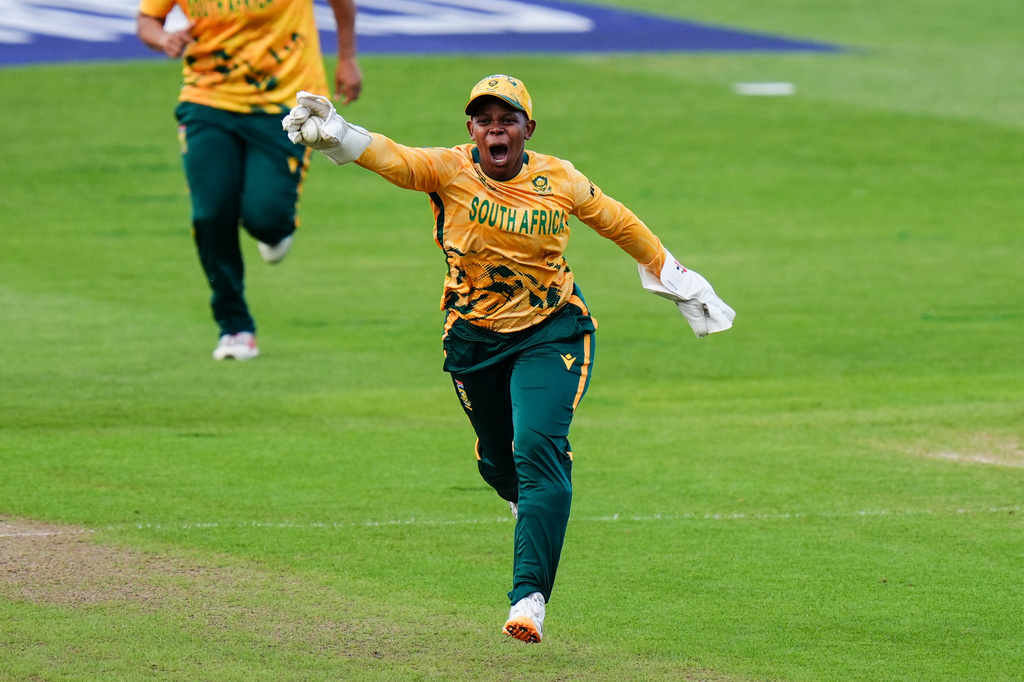 Sinalo Jafta of South Africa celebrates running out Rameen Shamim of Pakistan during the ICC Women's T20 World Cup cricket match between South Africa and Pakistan in Birmingham, England, Wednesday, June 17, 2026. (Jacob King/PA via AP)