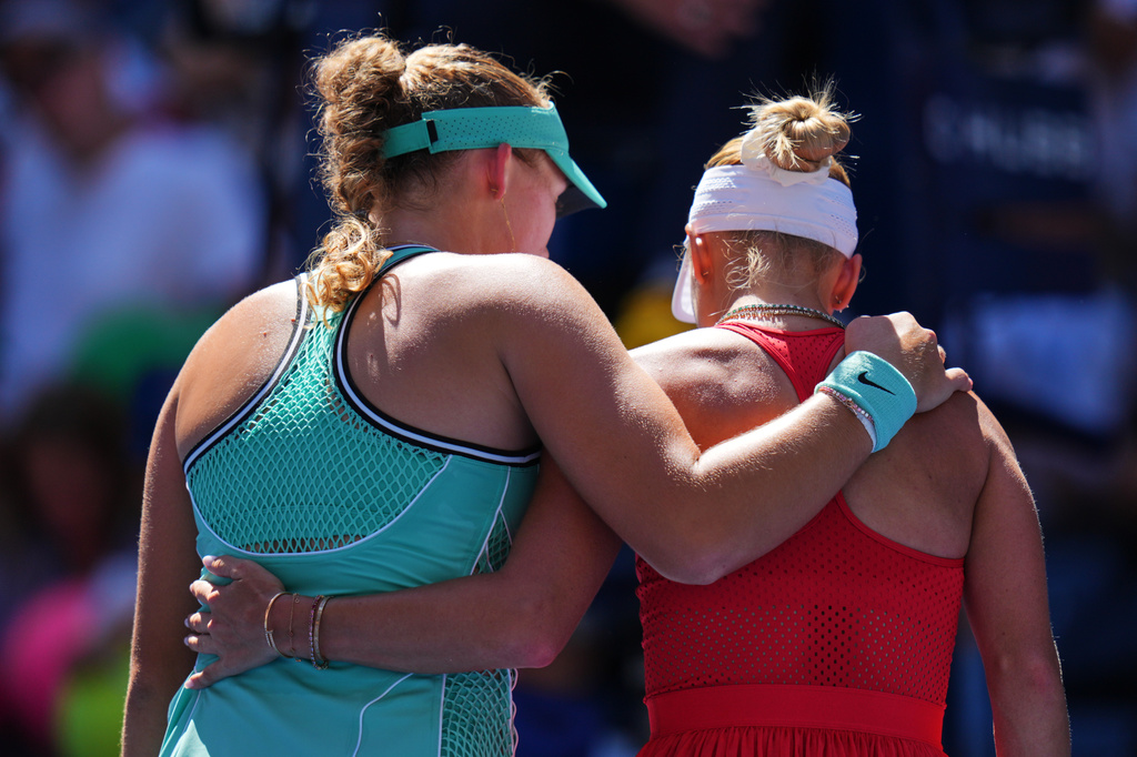 Mirra Andreeva, of Russia, left, hugs Anastasia Potapova, of Austria, after winning a match during the fourth round of the U.S. Open tennis championships, Monday, Sept. 7, 2026, in New York. (AP Photo/Kirsty Wigglesworth)
