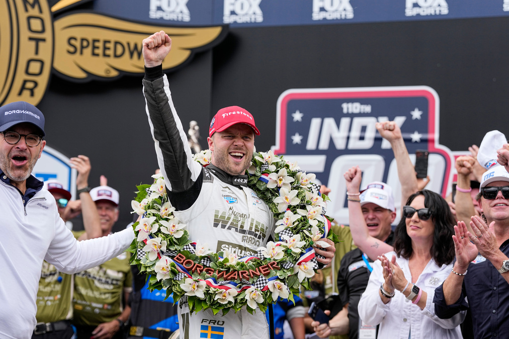 Felix Rosenqvist, center, of Sweden, celebrates after winning the Indianapolis 500 auto race at Indianapolis Motor Speedway in Indianapolis, Sunday, May 24, 2026. (AP Photo/Michael Conroy)
