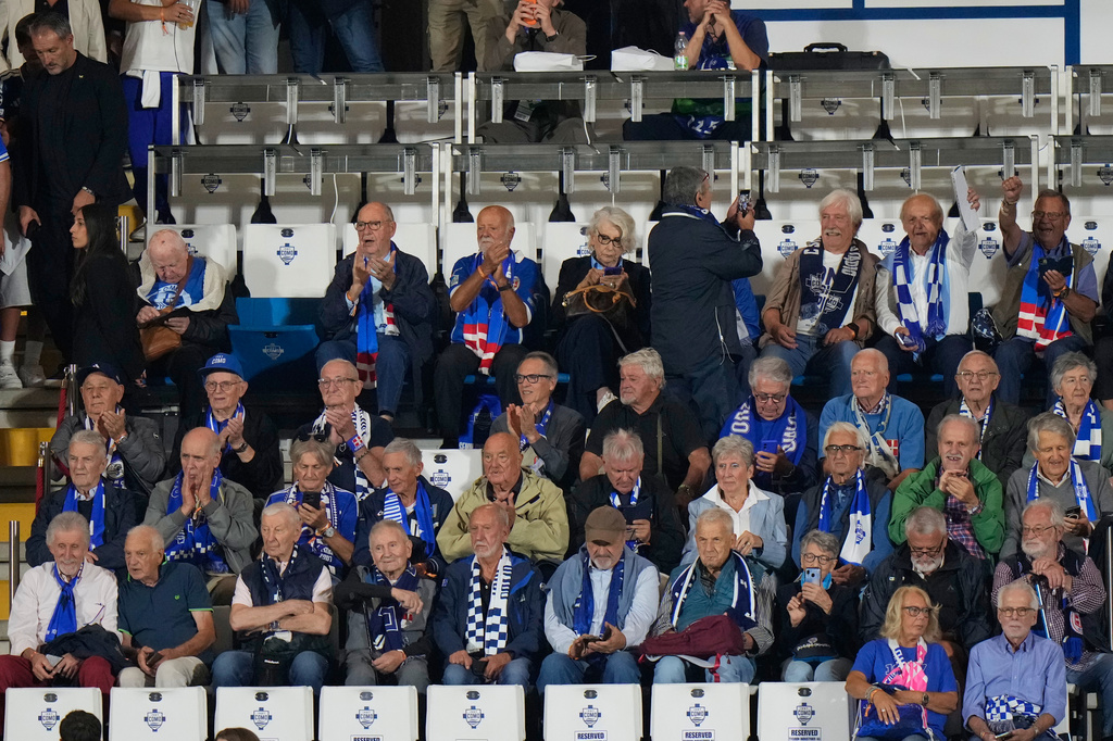 Como older fans sit on the tribune prior to the start of the Champions League opening phase soccer match between Como and Leipzig in Como, Italy, Thursday, Sept. 10, 2026, Como officials giving up seats to older fans. (AP Photo/Luca Bruno)