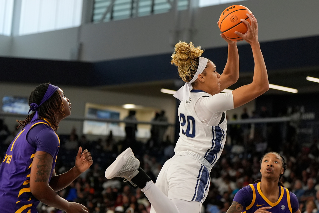 Georgia Southern forward Lia Anderson (20) grabs a rebound against Louisiana State during the first half of an NCAA women's basketball game, Sunday, Nov. 9, 2025, in Statesboro. (AP Photo/Mike Stewart)