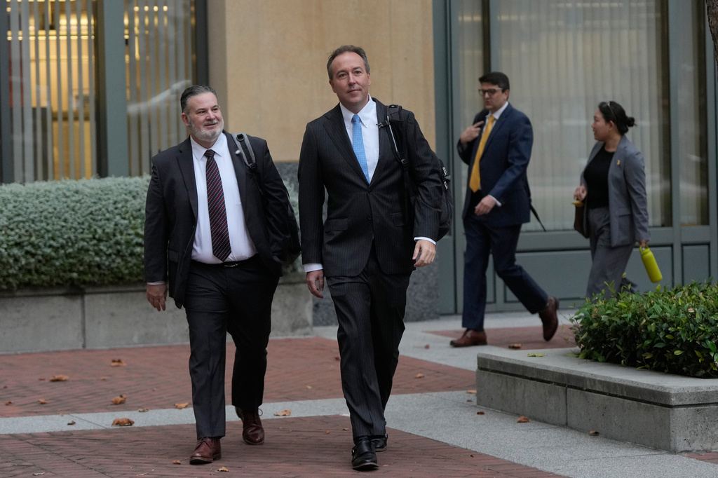 Kentucky Division Chief of Consumer and Senior Protection Chris Lewis, left, and Colorado's Chief Trial Counsel Jason Slouthouber, middle, arrive at a Federal Courthouse Wednesday, Aug. 12, 2026, in Oakland, Calif. (AP Photo/Jeff Chiu)