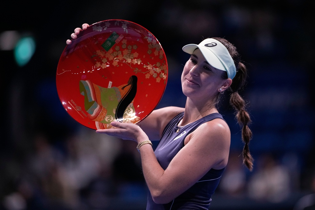 Switzerland's Belinda Bencic celebrates after winning against Czech Republic's Linda Noskova in the final match of the Pan Pacific Open women's tennis tournament at Ariake Coliseum, in Tokyo, Sunday, Oct. 26, 2025. (AP Photo/Louise Delmotte)