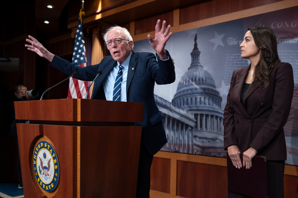 Sen. Bernie Sanders, I-Vt., left, and Rep. Alexandria Ocasio Cortez, D-N.Y., hold a news conference on the Artificial Intelligence Data Center Moratorium Act, at the Capitol in Washington, Wednesday, March 25, 2026. (AP Photo/J. Scott Applewhite)