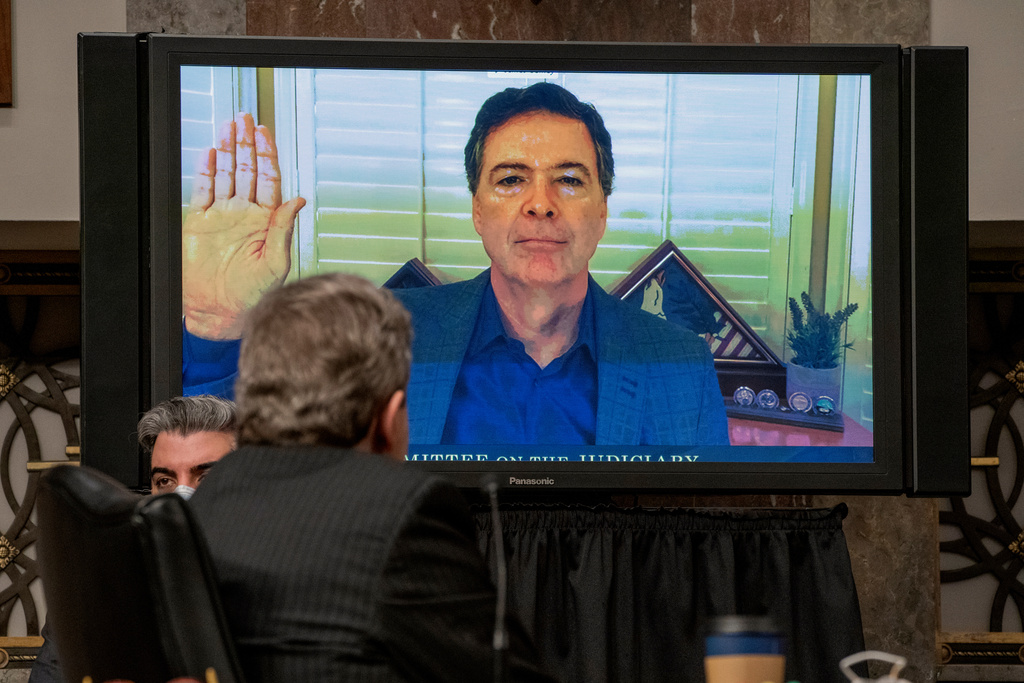FILE - Former FBI director James Comey is sworn via videoconference before testifying during a Senate Judiciary Committee hearing on Capitol Hill in Washington, Wednesday, Sept. 30, 2020, to examine the FBI "Crossfire Hurricane" investigation. (Ken Cedeno/Pool via AP, File)