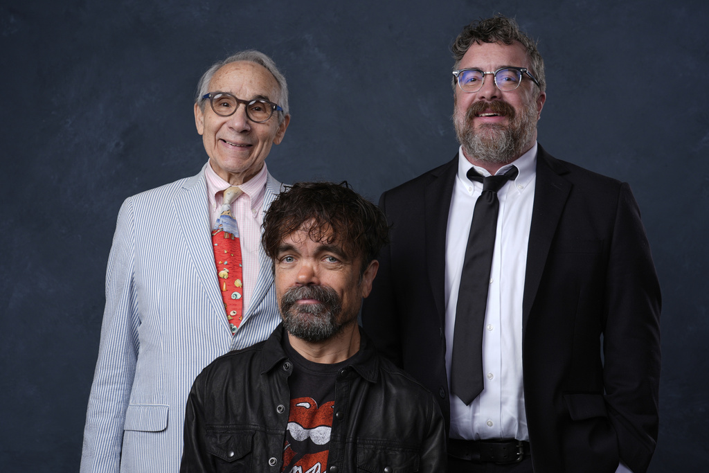 FILE - Lloyd Kaufman, from left, Peter Dinklage, and director Macon Blair pose for a portrait to promote "The Toxic Avenger" during Comic-Con International on Thursday, July 24, 2025, in San Diego. (AP Photo/Chris Pizzello, File)