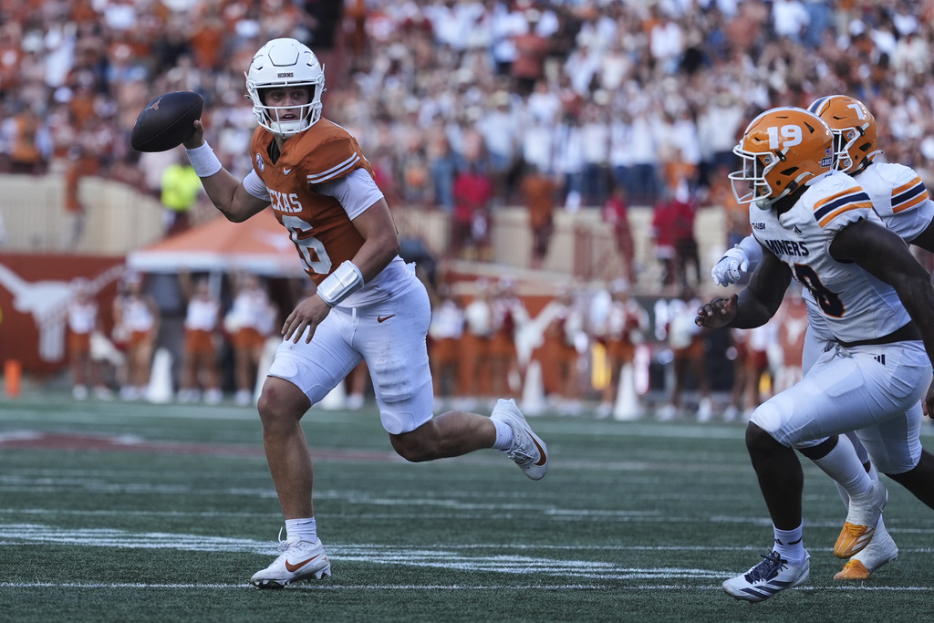Texas quarterback Arch Manning (16) is pressured by UTEP defensive lineman Ashaad Hall (19) as he looks to pass during the second half of an NCAA college football game in Austin, Texas, Saturday, Sept. 13, 2025. (AP Photo/Eric Gay)