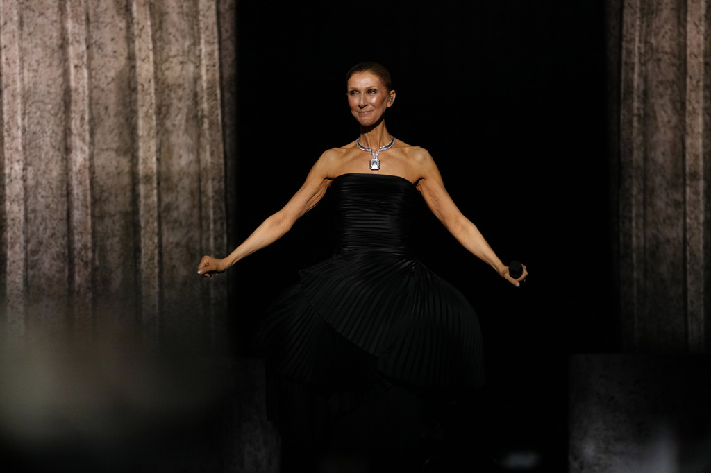 Singer Celine Dion performs during the opening concert of her 'Celine Dion Paris 2026' residency at the Plenitude Arena in Nanterre, outside Paris, Saturday, Sept. 12, 2026. (AP Photo/Aurelien Morissard)