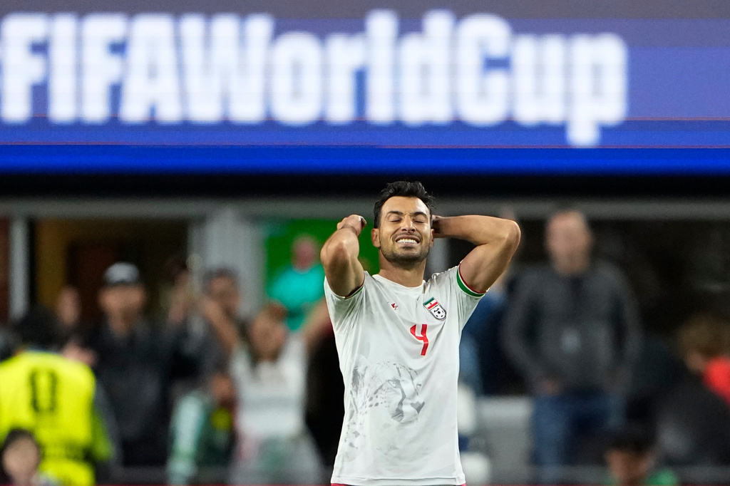 Iran's Shoja Khalilzadeh (4) reacts at the end of the World Cup Group G soccer match between Egypt and Iran in Seattle, Friday, June 26, 2026. (AP Photo/Lindsey Wasson)