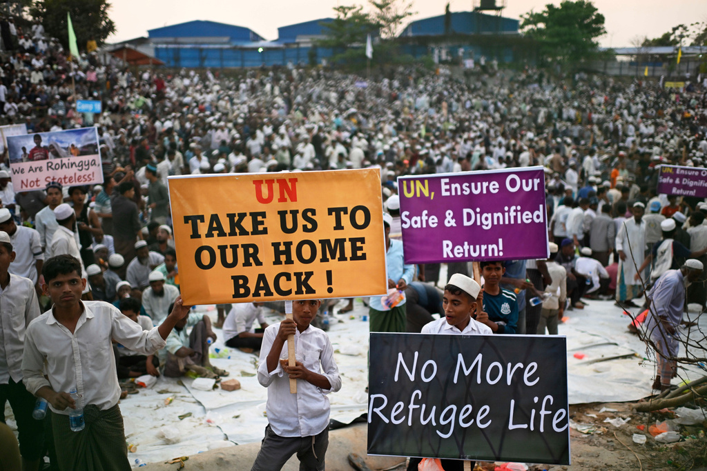 FILE - Rohingya refugee children carry banners during a visit by U.N. Secretary-General António Guterres at the Ukhiya camp in Cox's Bazar, in Bangladesh, March 14, 2025. (AP Photo/Mahmud Hossain Opu, File)