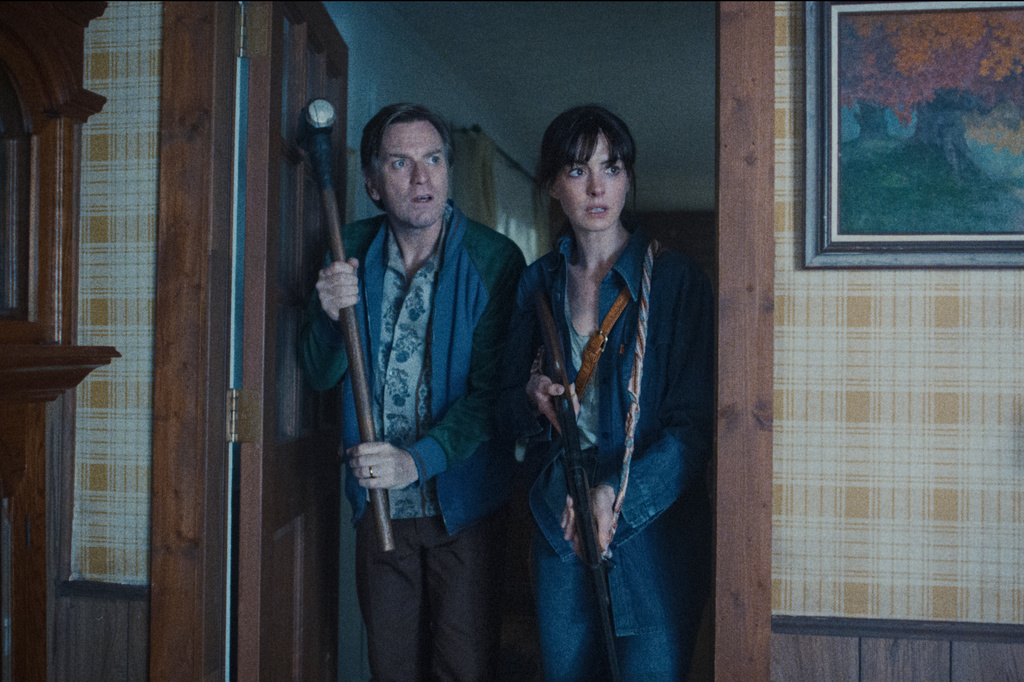 This image released by Warner Bros. Pictures shows Ewan McGregor, left, and Anne Hathaway in a scene from "The End of Oak Street." (Warner Bros. Pictures via AP)