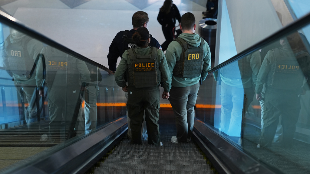Federal law enforcement officers move through Philadelphia International Airport, Tuesday, March 24, 2026, in Philadelphia. (AP Photo/Matt Rourke)