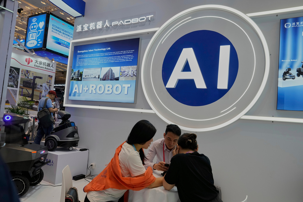 FILE -Vendors for AI enabled robots wait for customers at the 137th Canton Fair in Guangzhou in southern China's Guangdong province on April 16, 2025. (AP Photo/Ng Han Guan, File)