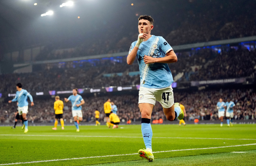 Manchester City's Phil Foden celebrates scoring the opening goal during the Champions League opening phase match against Borussia Dortmund, Wednesday, Nov. 5, 2025, in, Manchester, England. (Nick Potts/PA via AP)