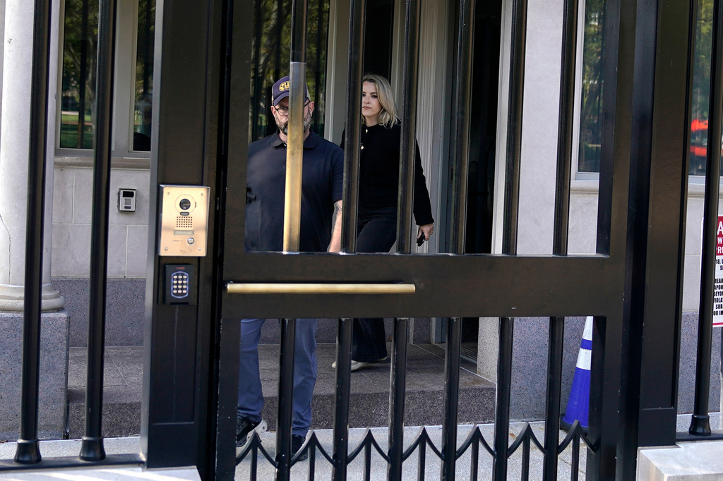 CNN Senior White House Reporter Betsy Klein, right, departs after having her credential revoked following President Donald Trump's ban on CNN, MS NOW and Politico, at the White House, Saturday, Sept. 19, 2026, in Washington. (AP Photo/Jose Luis Magana)