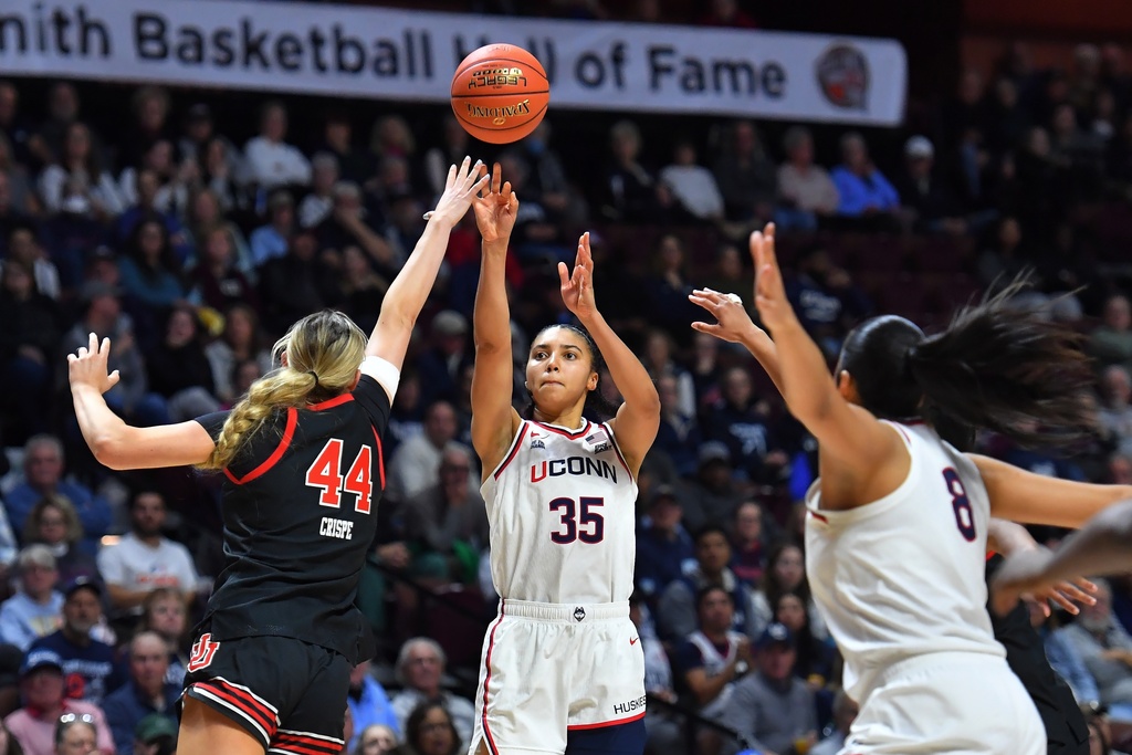 UConn guard Azzi Fudd (35) shoots at the basket as Utah forward Samantha Crispe (44) defends in the second half of an NCAA college basketball game, Sunday, Nov. 23, 2025, in Uncasville, Conn. (AP Photo/Steven Senne)