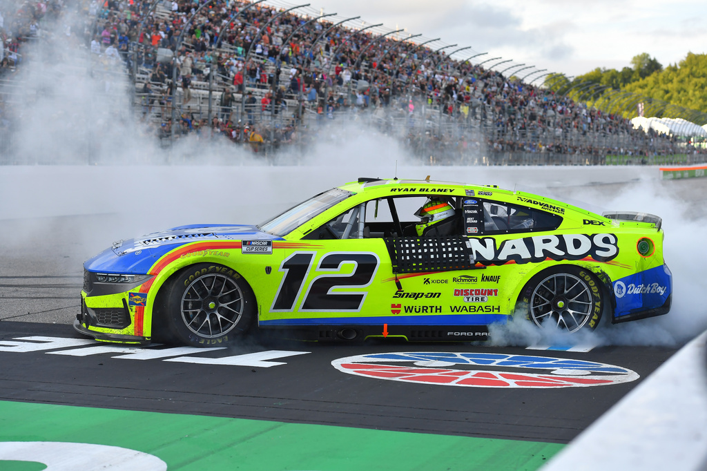 Ryan Blaney spins the wheels of his car after winning a NASCAR Cup Series auto race, Sunday, Aug. 23, 2026, in Loudon, N.H. (AP Photo/Steven Senne)