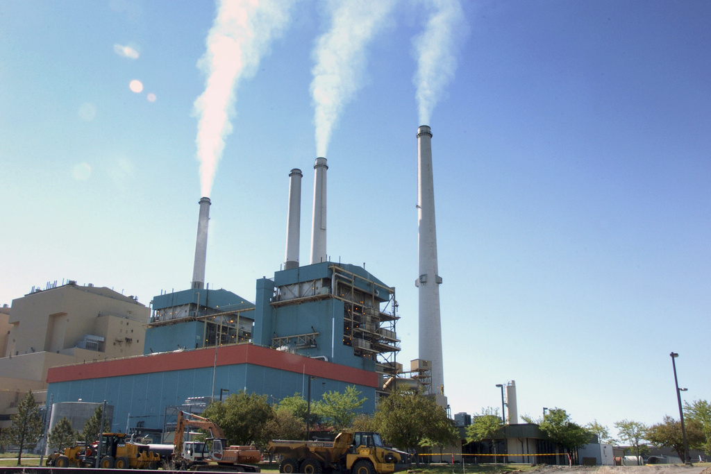 FILE - Gas emissions rises from a coal-burning power plant in Colstrip, Mont., July 1, 2013. (AP Photo/Matthew Brown, File)