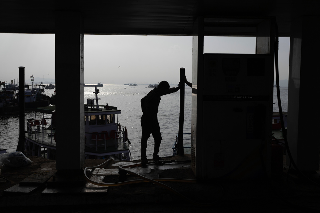 A fisherman stands next to a cooperative diesel pump that is shut due to rising bulk fuel prices at Bhaucha Dhakka in Mumbai, India, Wednesday, April 8, 2026. (AP Photo/Rafiq Maqbool)