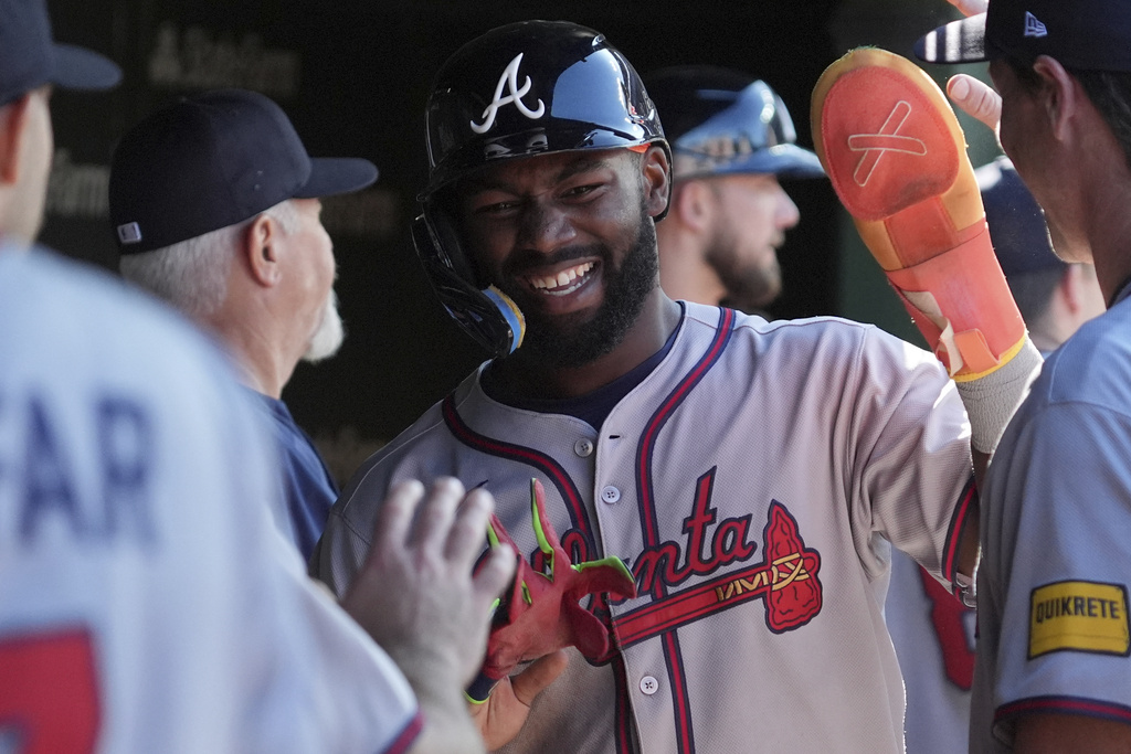 Atlanta Braves' Michael Harris II celebrates with teammates after scoring on a one-run double by Nacho Alvarez Jr. during the fifth inning of a baseball game against the Chicago Cubs in Chicago, Monday, Sept. 1, 2025. (AP Photo/Nam Y. Huh)