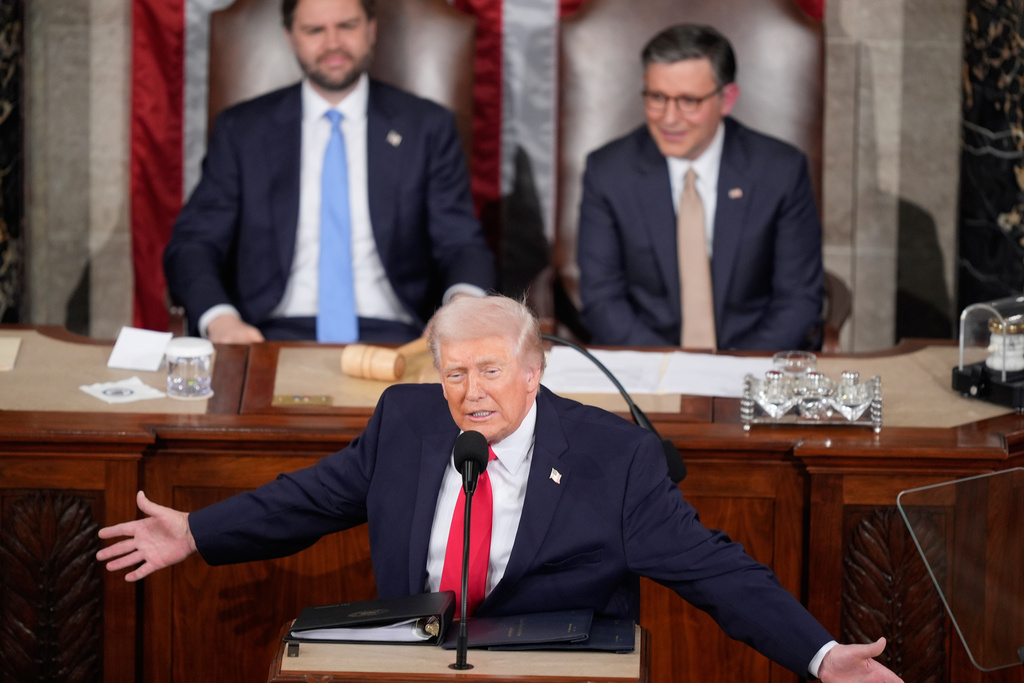 President Donald Trump delivers the State of the Union address to a joint session of Congress in the House chamber at the U.S. Capitol in Washington, Tuesday, Feb. 24, 2026, as Vice President JD Vance and House Speaker Mike Johnson of La., listen. (AP Photo/Mark Schiefelbein)