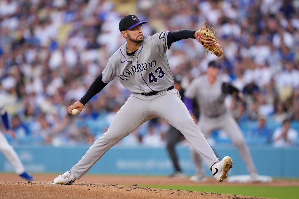 Colorado Rockies starting pitcher Gabriel Hughes throws to the plate during the first inning of a baseball game against the Los Angeles Dodgers, Wednesday, July 8, 2026, in Los Angeles. (AP Photo/Mark J. Terrill)