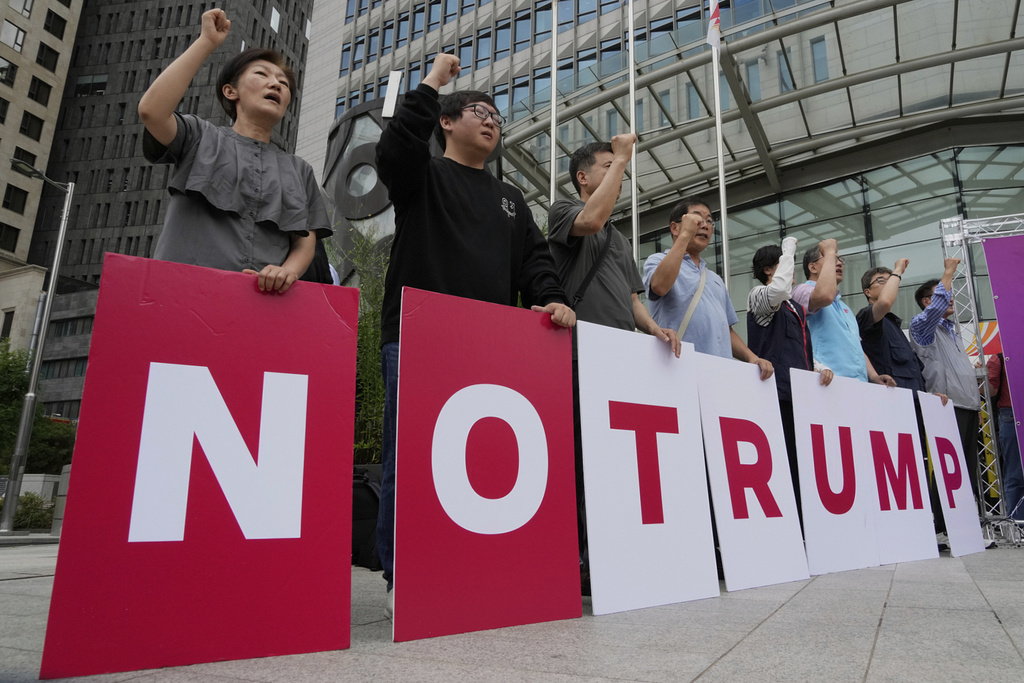 Members of civic groups stage a rally against U.S. President Donald Trump's tariffs policy in Seoul, South Korea, Monday, June 30, 2025. (AP Photo/Ahn Young-joon)