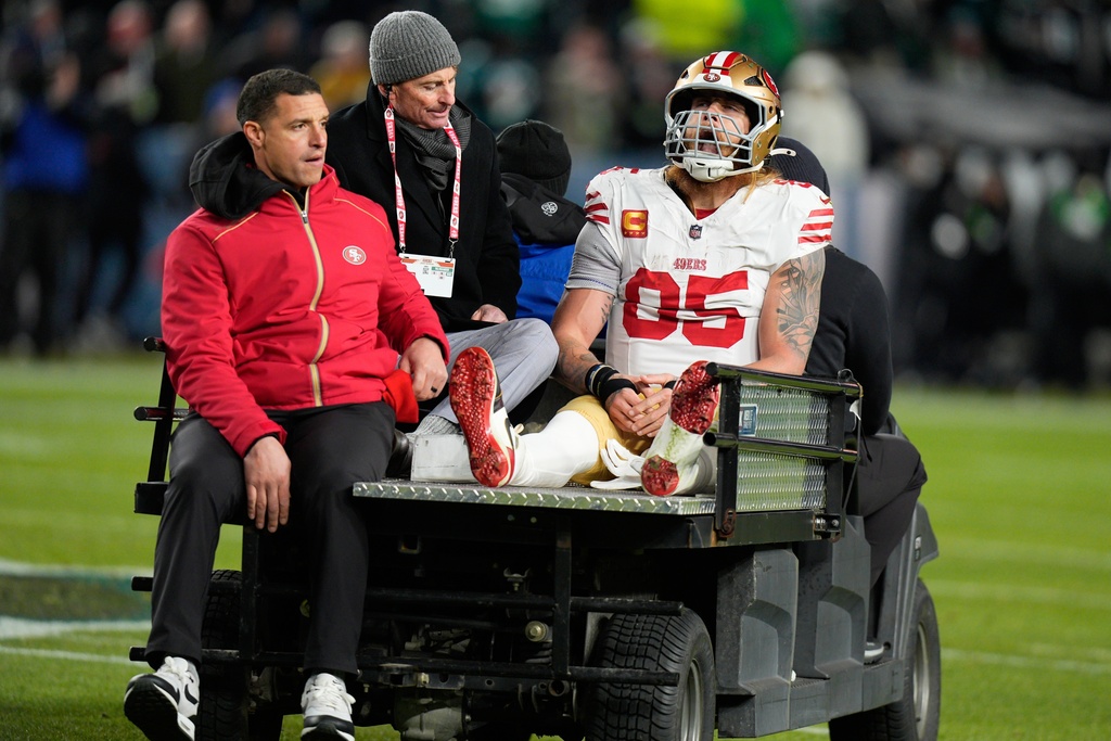 San Francisco 49ers tight end George Kittle is carted off the field after an injury during the first half of an NFL wild-card playoff football game against the Philadelphia Eagles on Sunday, Jan. 11, 2026, in Philadelphia. (AP Photo/Chris Szagola)