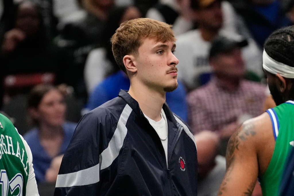 Dallas Mavericks' Cooper Flagg stands by the bench in the second half of an NBA basketball game against the Minnesota Timberwolves Wednesday, Jan. 28, 2026, in Dallas. (AP Photo/Tony Gutierrez)
