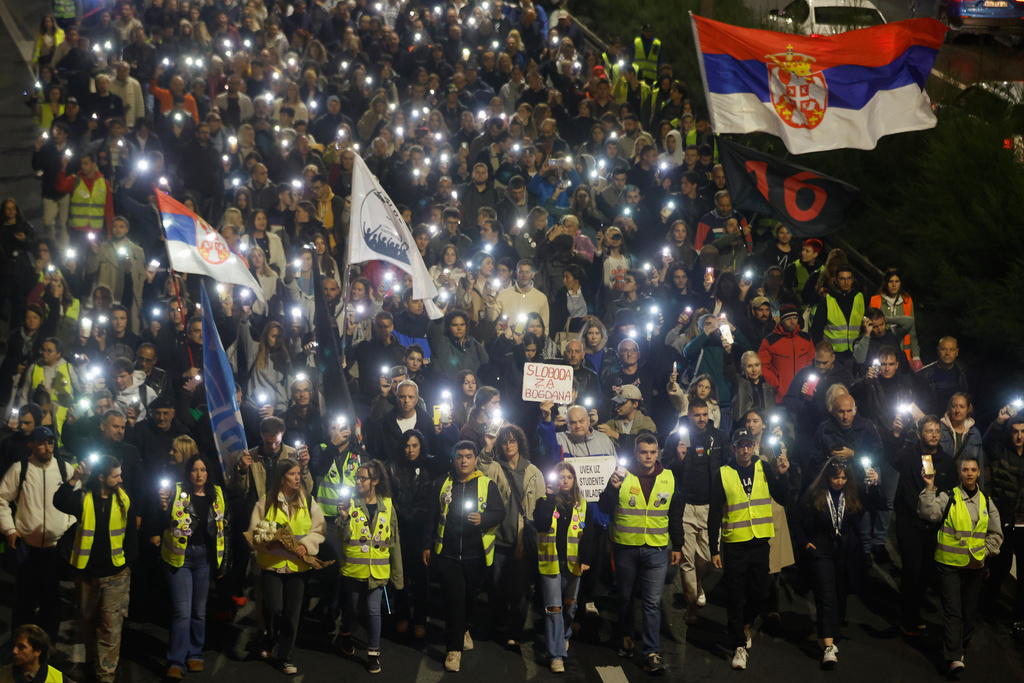 People march during a protest eleven months after the deadly train station tragedy that sparked mass demonstrations against corruption in Belgrade, Serbia, Wednesday, Oct. 1, 2025. (AP Photo/Marko Drobnjakovic)