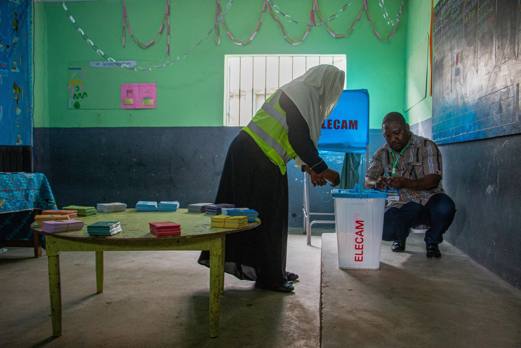 Election officials set up ballot materials before the start of voting at a polling station in Garoua, Cameroon, Sunday, Oct. 12, 2025.(AP Photo/Welba Yamo Pascal)