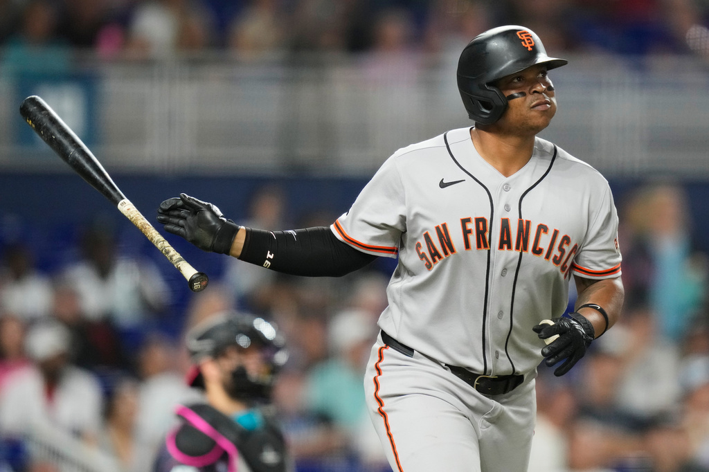 San Francisco Giants' Rafael Devers watches after hitting a solo home run during the sixth inning of a baseball game against the Miami Marlins, Friday, June 19, 2026, in Miami. (AP Photo/Lynne Sladky)